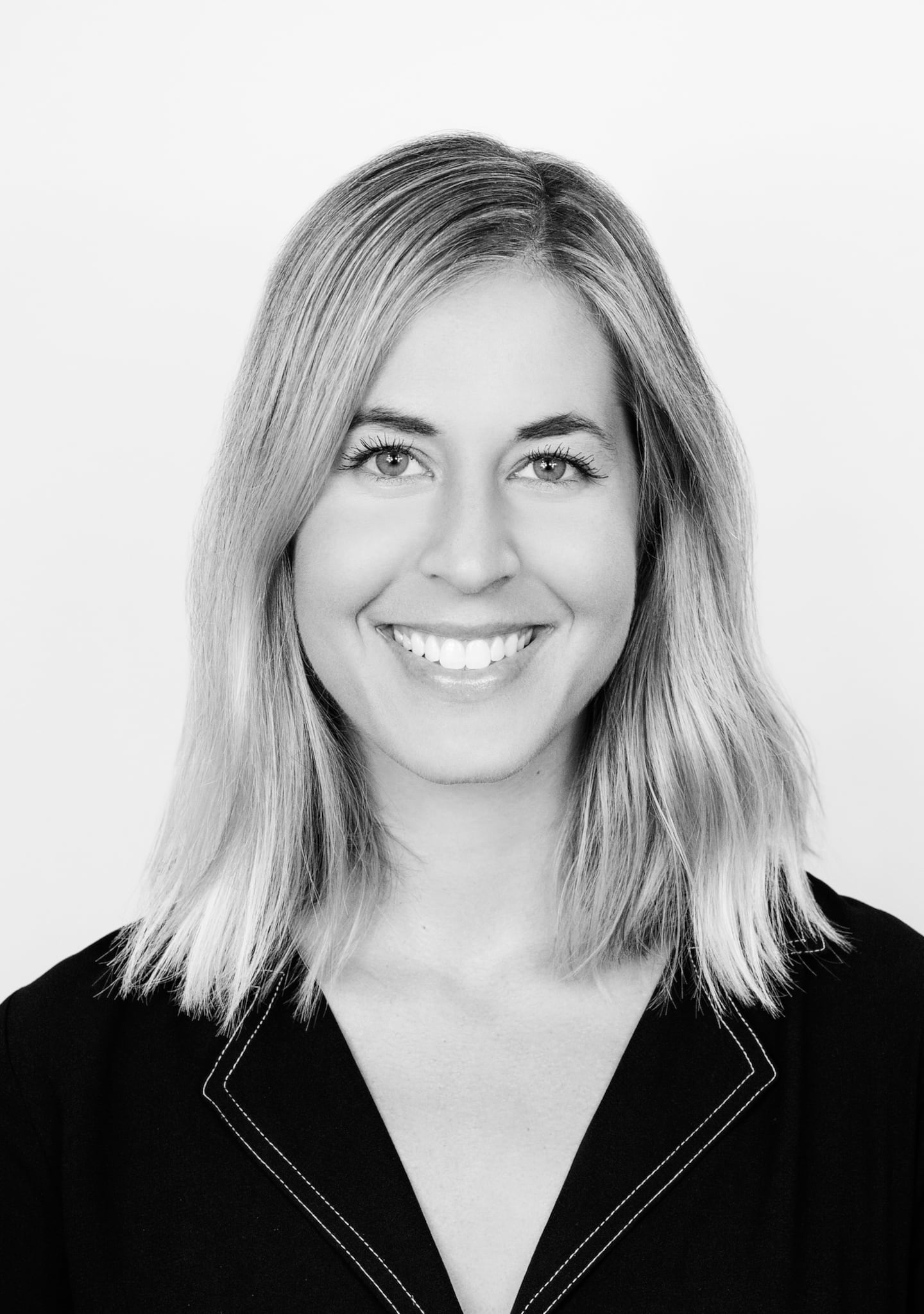 A black and white headshot of the executive Hannah Beals